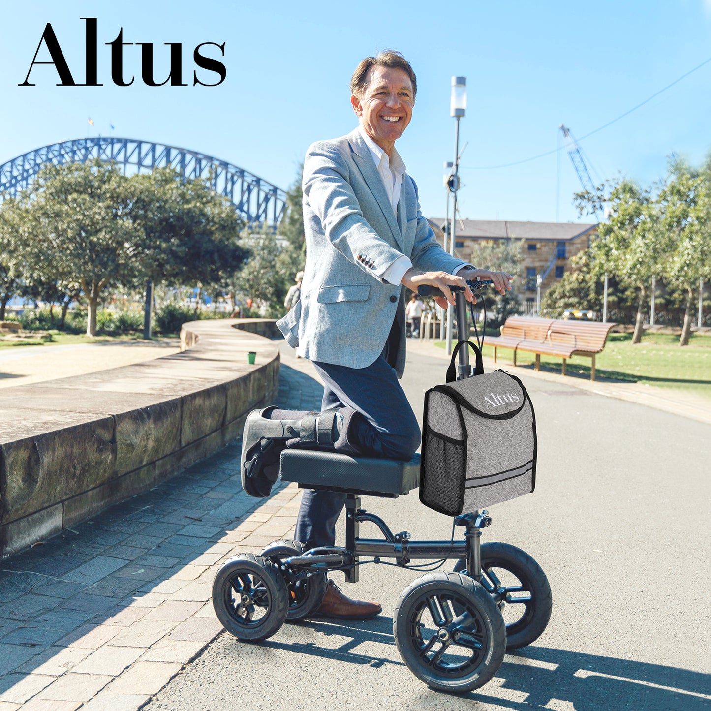 Man using a knee walker with a bag on a sidewalk, with 'Altus' branding.