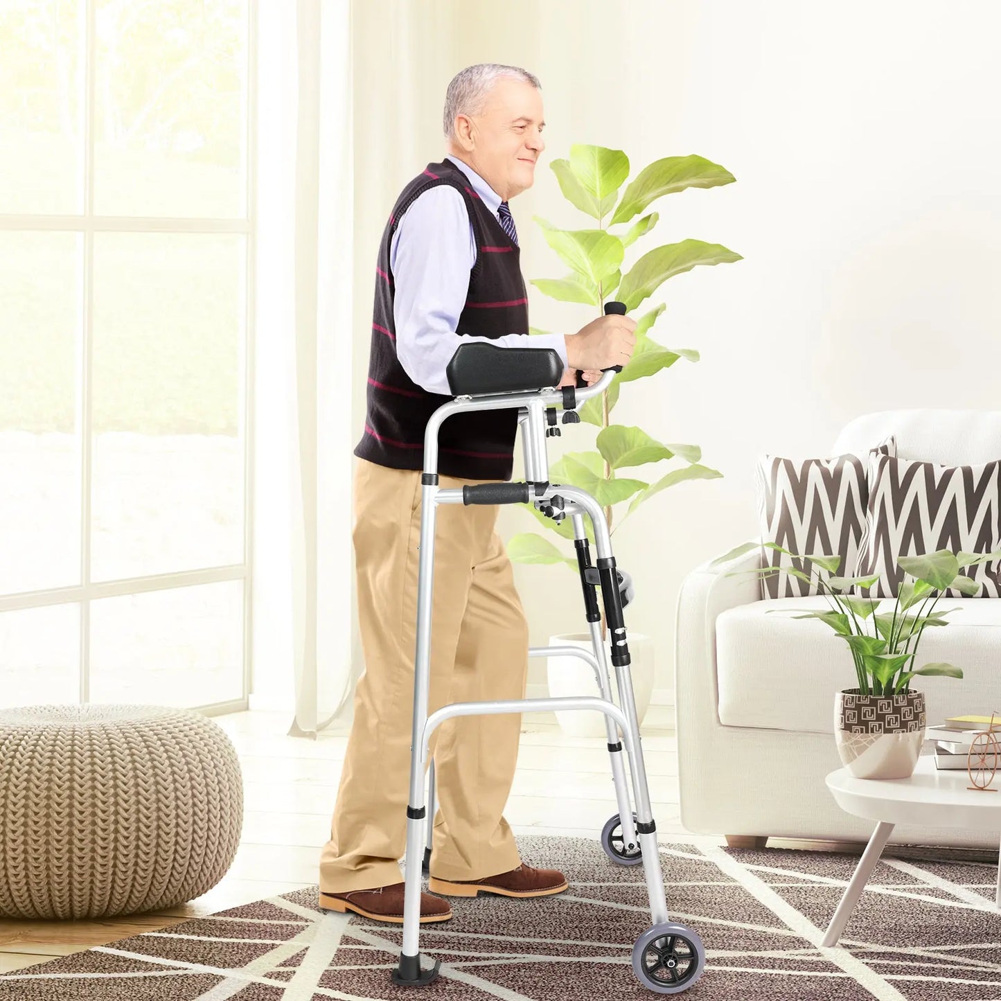 Elderly Man Using Walker: An elderly man in a sweater vest and slacks is shown using a walker in a bright, sunny room, indicating the product's everyday utility and comfort.