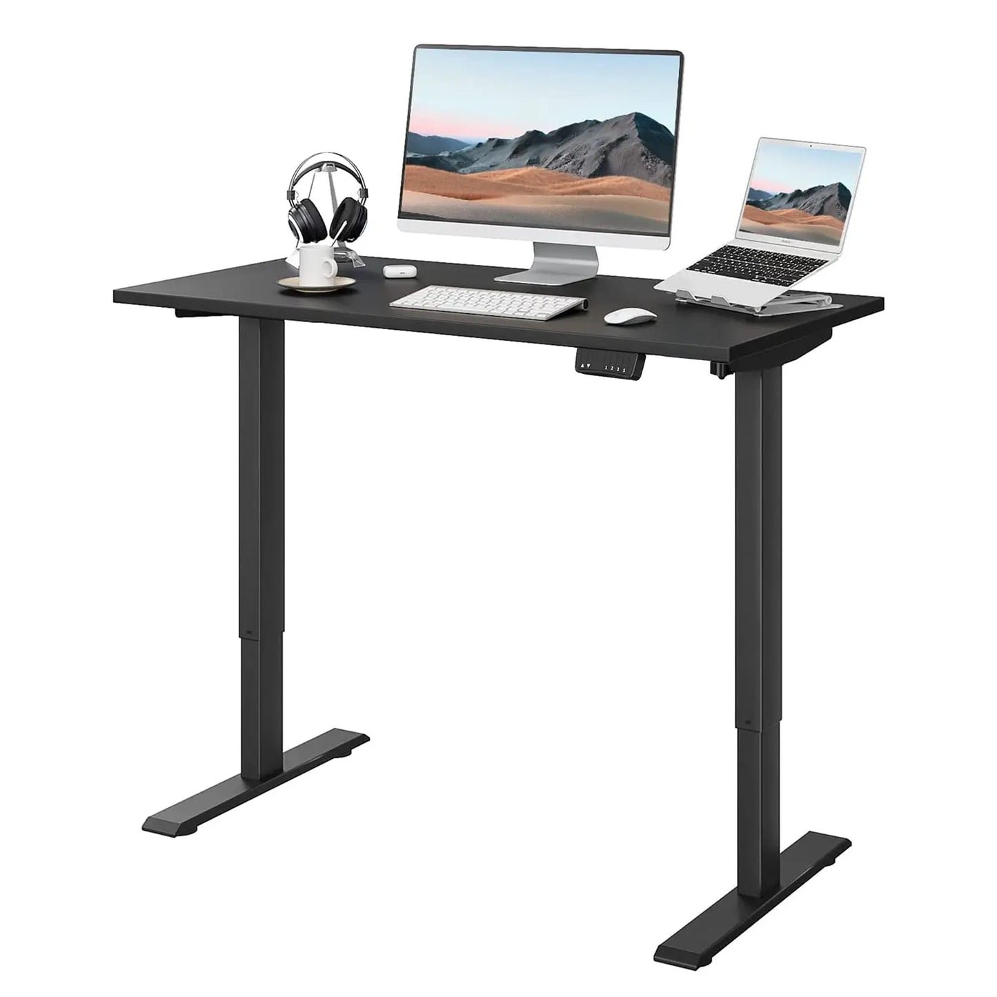 Black motorized standing desk with adjustable height, dual monitors, keyboard, mouse, headphones, and a sleek control panel for office setup.