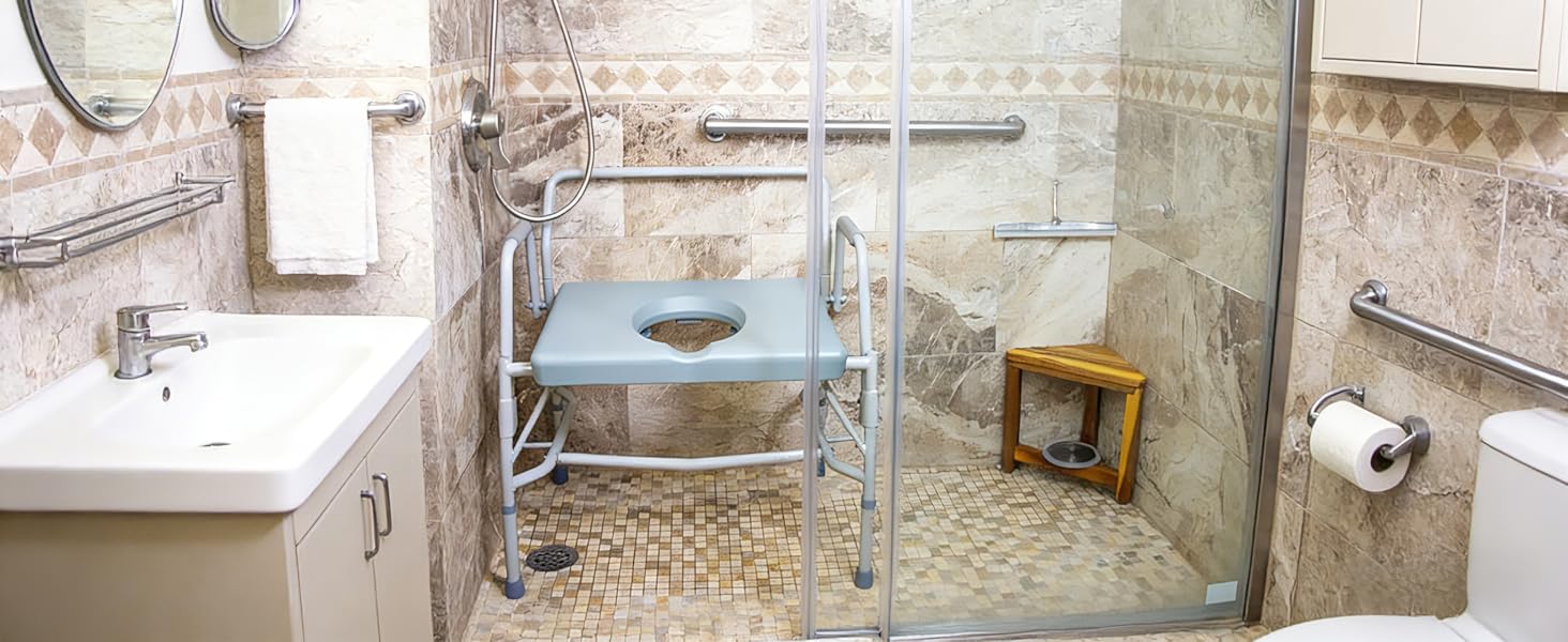 Bathroom with shower, sink, and toilet with grab bars for accessibility