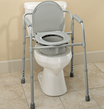 Gray toilet seat with metal frame attached to a white toilet on a tiled floor.