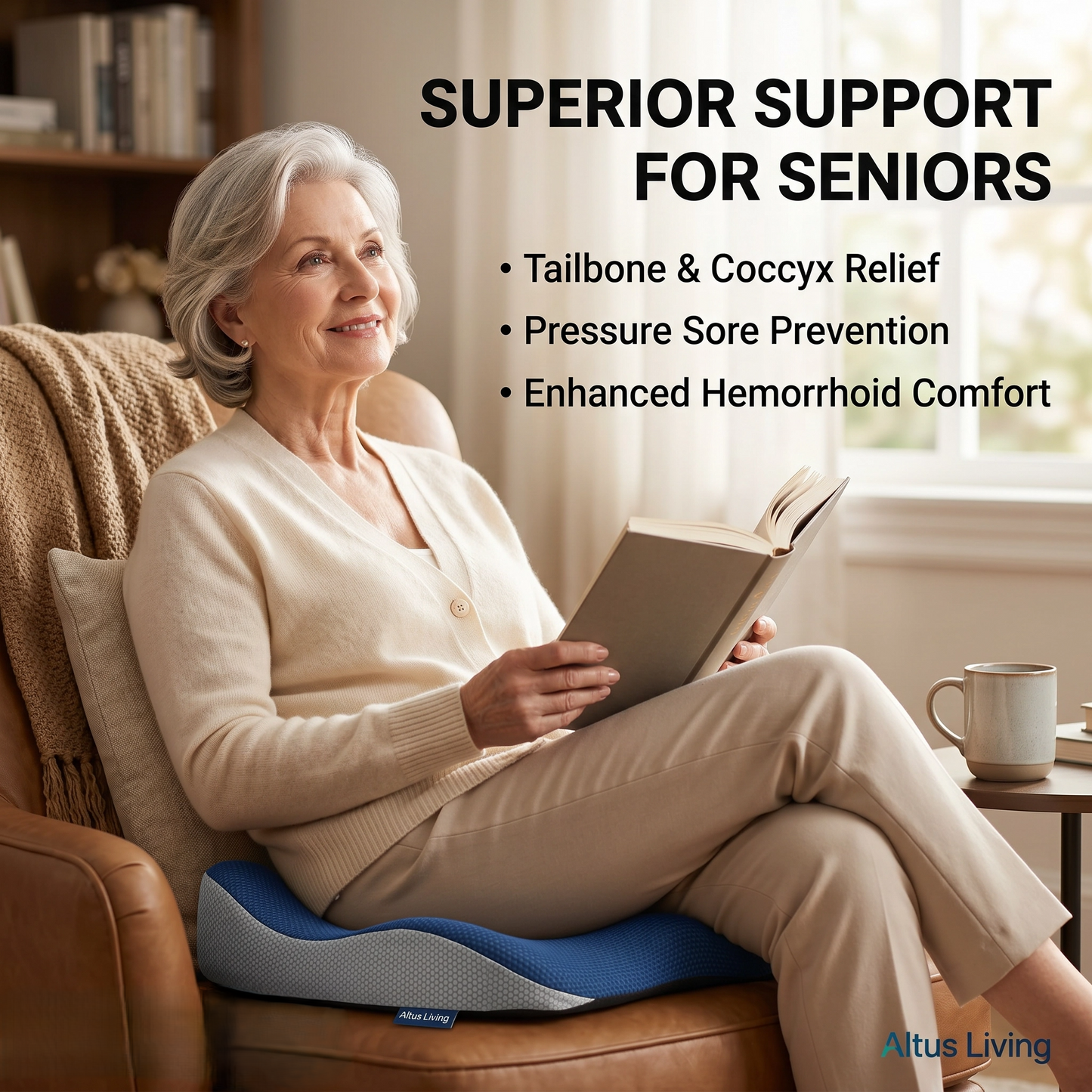 An older woman sits in a brown leather armchair reading a book, using a blue and white Altus Living lumbar support cushion. The image features promotional text highlighting the benefits of the cushion, including tailbone and coccyx relief, pressure sore prevention, and enhanced hemorrhoid comfort.