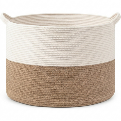 A round rope storage basket with two side handles, featuring a two-tone design with a cream upper half and a natural tan lower half, set against a plain white background.