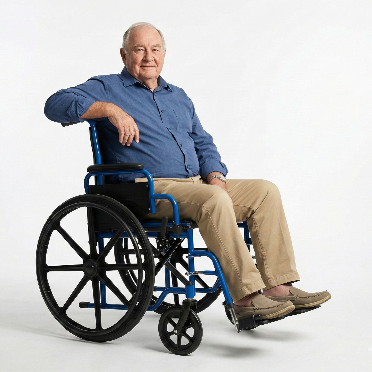 A senior man comfortably seated in the manual wheelchair, demonstrating its supportive design for everyday mobility and relaxed daily use.