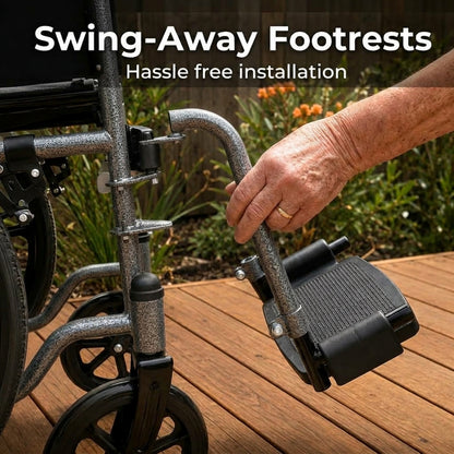 A close-up of a hand attaching a black and silver swing-away footrest to a wheelchair on a wooden deck outdoors. Text at the top reads 'Swing-Away Footrests Hassle free installation'.