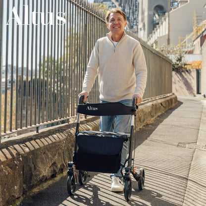 Stay active and independent with the Altus 8-inch Euro Rollator. This rollator is perfect for daily use, offering stability and ease of movement, as shown by this user navigating an urban environment.