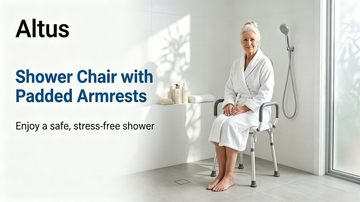 An elderly woman sits on a white and gray Altus shower chair with padded armrests in a bright, modern bathroom. The image includes text overlays highlighting the product features: 'Altus Shower Chair with Padded Armrests'.