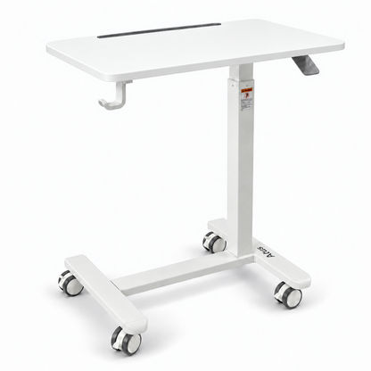 A white adjustable medical or hospital-style standing table with a height-adjustable metal frame, caster wheels, a top tray, and a built-in black slot on the tabletop, shown on a clean white background.