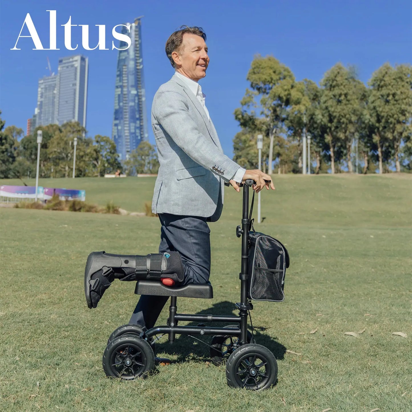 A man is using the knee walker in a park, dressed in a smart casual outfit. This image demonstrates the knee walker’s effectiveness as a mobility aid in an outdoor setting, allowing users to maintain an active lifestyle while recovering from an injury.