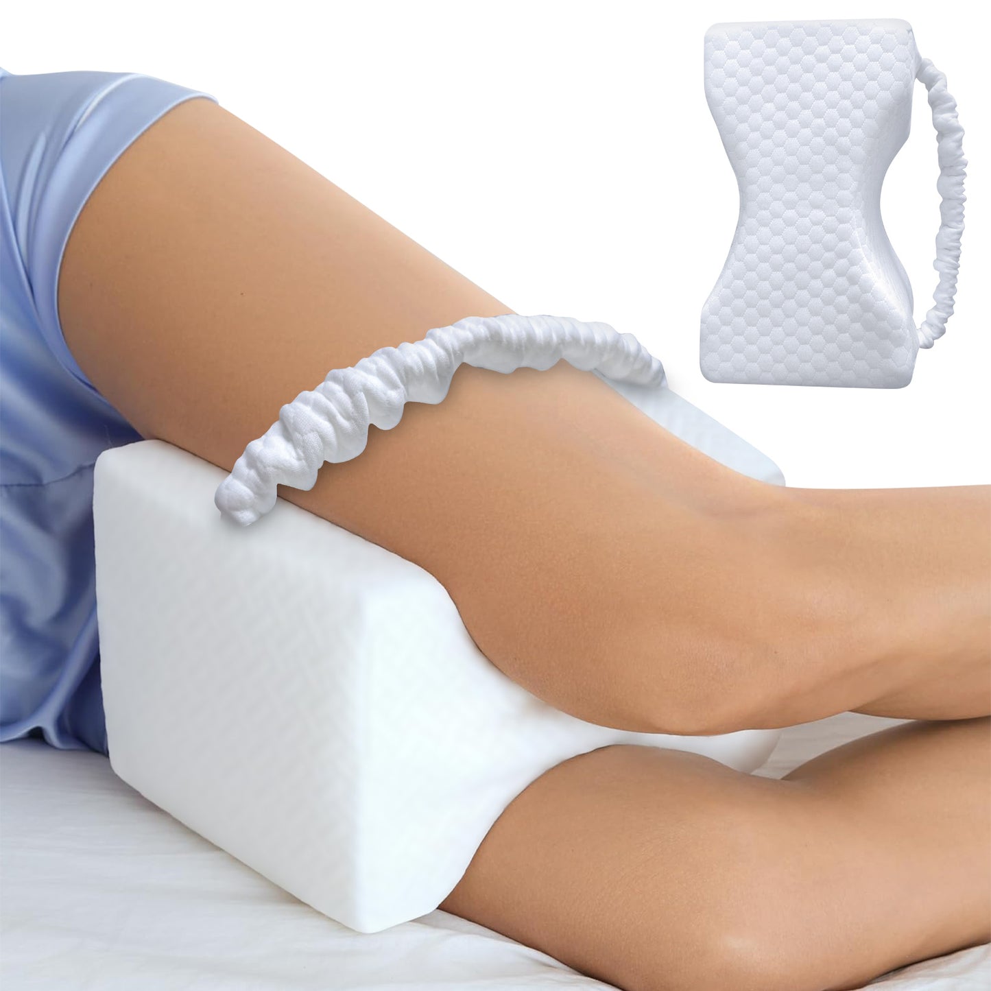 Person using a white wedge pillow with a small quilted pillow on top, on a plain background.