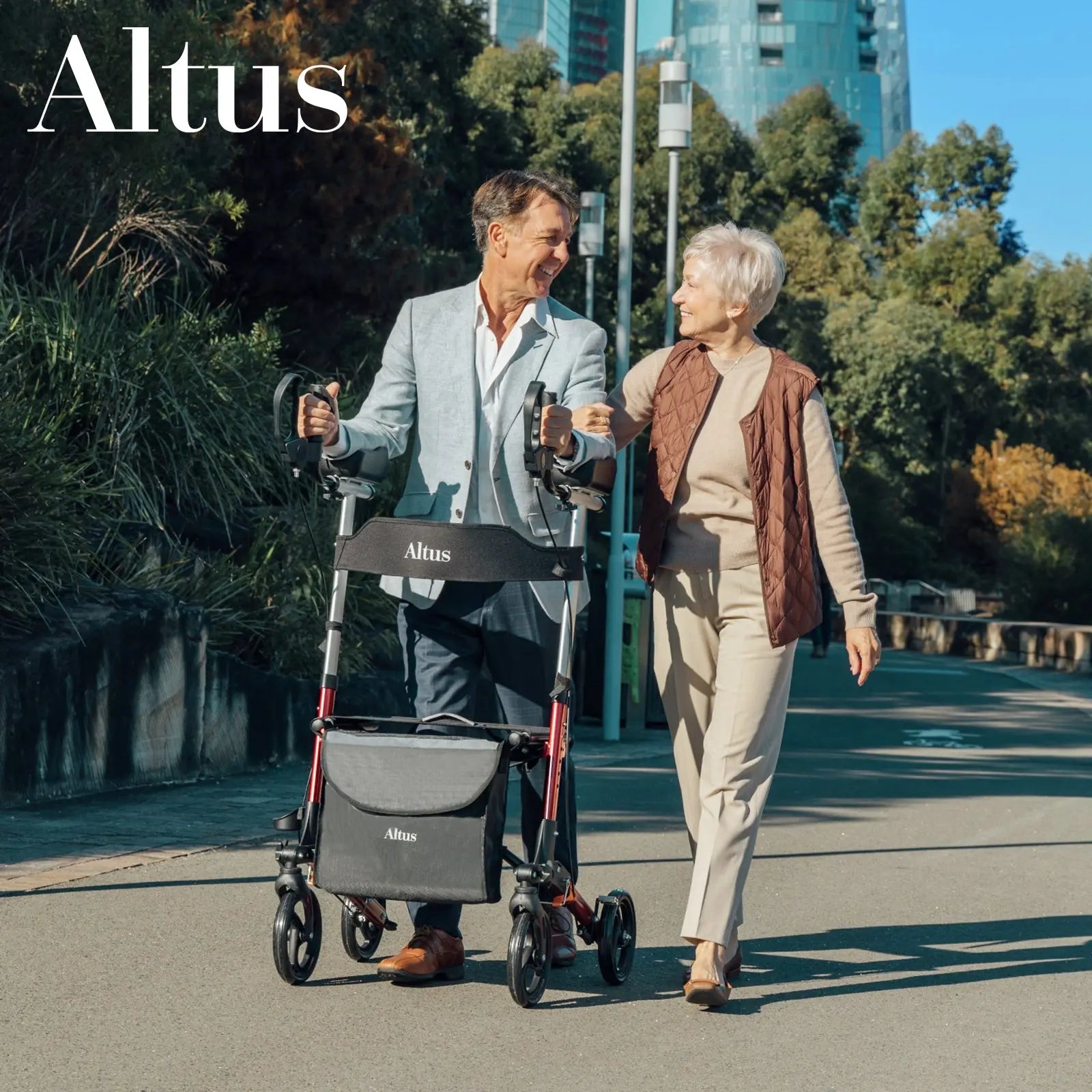 A senior man and woman strolling in a park with the Altus Ergonomic Upright Walker with Seat. This walker offers excellent support with its comfortable seat and adjustable handles, perfect for active seniors