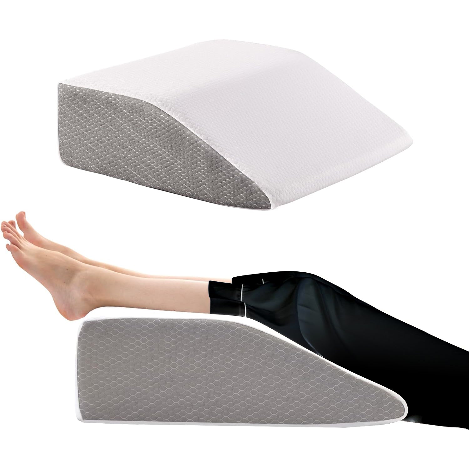Gray wedge pillow with a person using it to support their leg on a white background