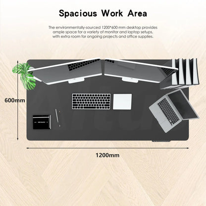 Overhead view of a 1200x600 mm black desk with laptops, keyboard, mouse, and office supplies, highlighting ample workspace.