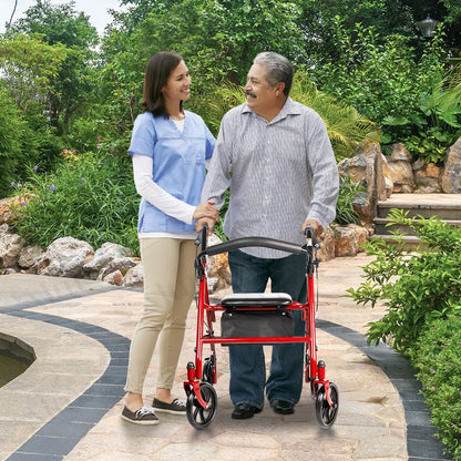 Elderly man using the red rollator walker, assisted by a caregiver in a garden setting.